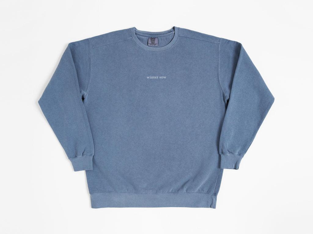 Blue sweatshirt with text on a white background