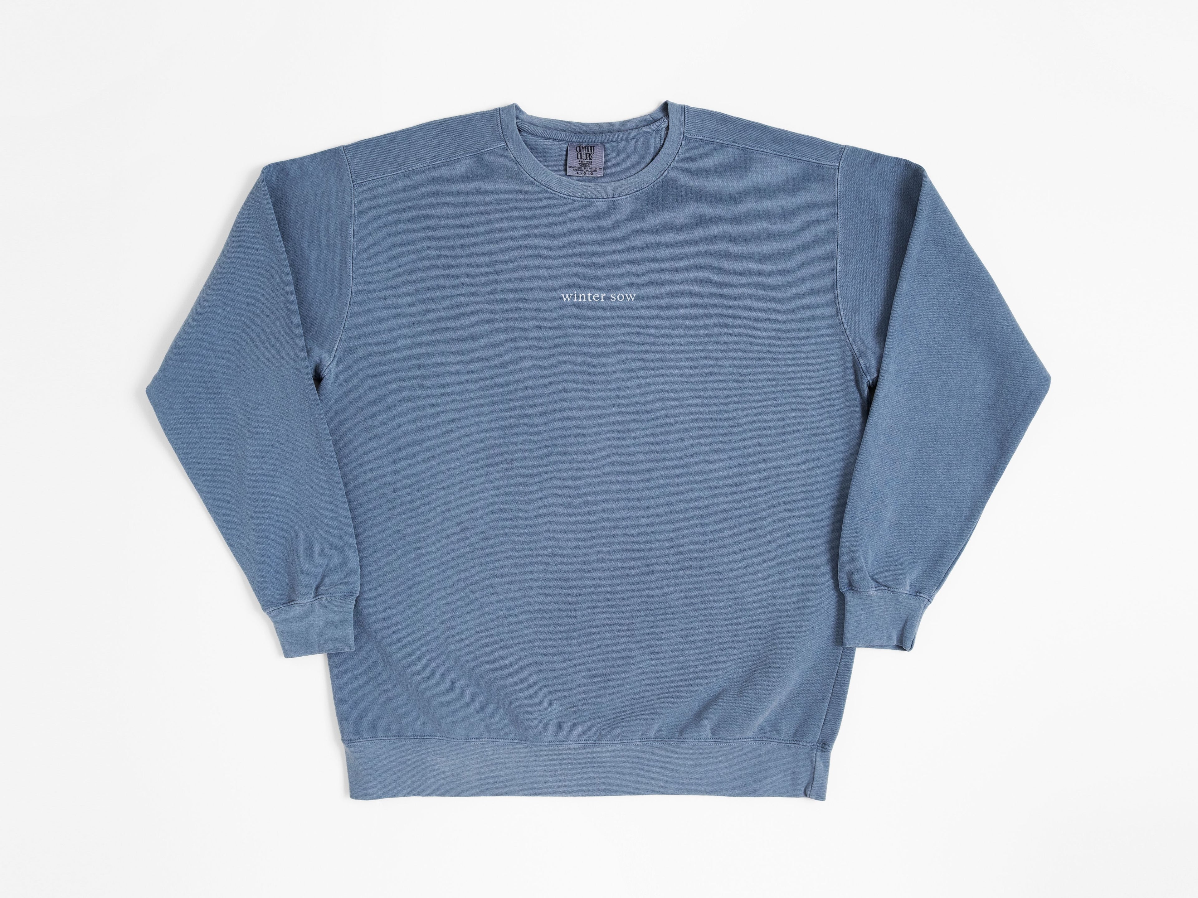 Blue sweatshirt with text on a white background