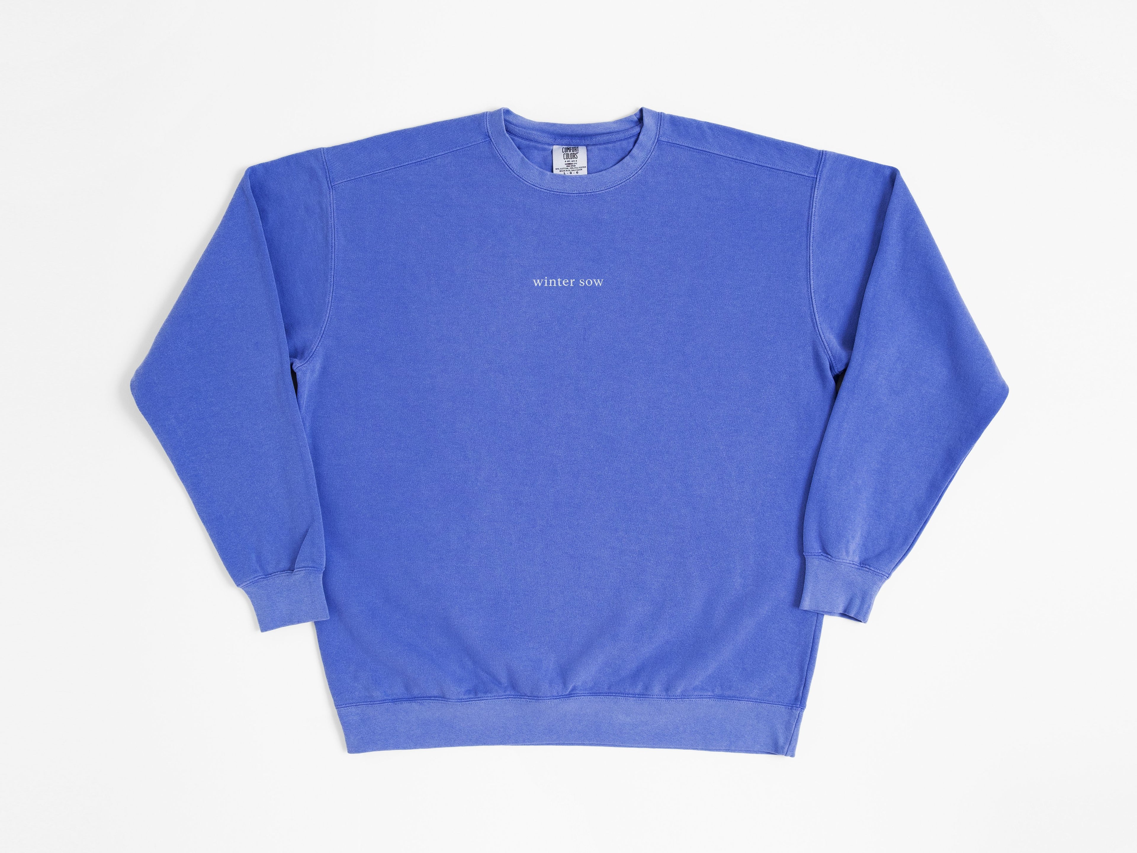 Blue sweatshirt with text on a white background